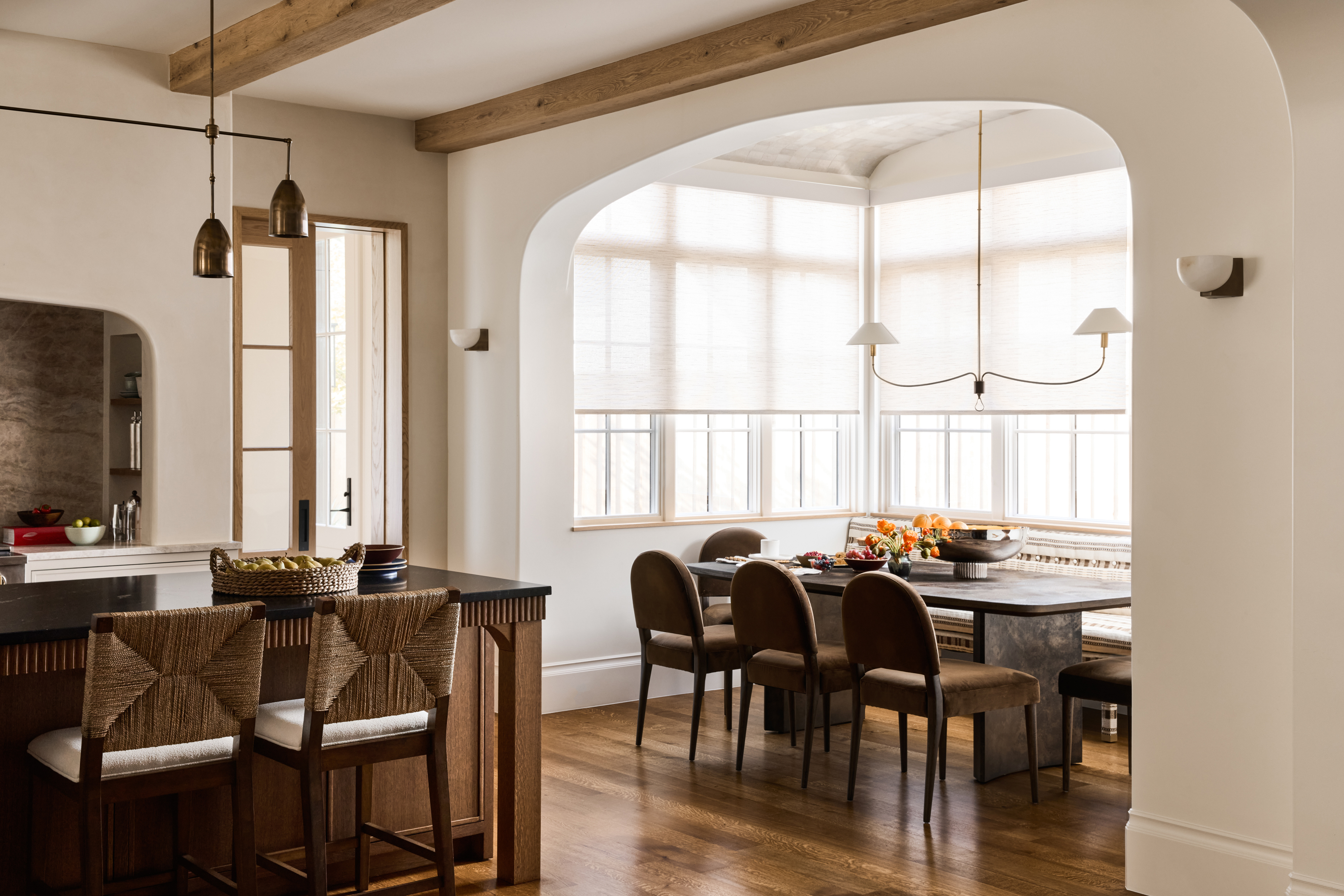 Meadowglen dining room framed by a softly curved opening